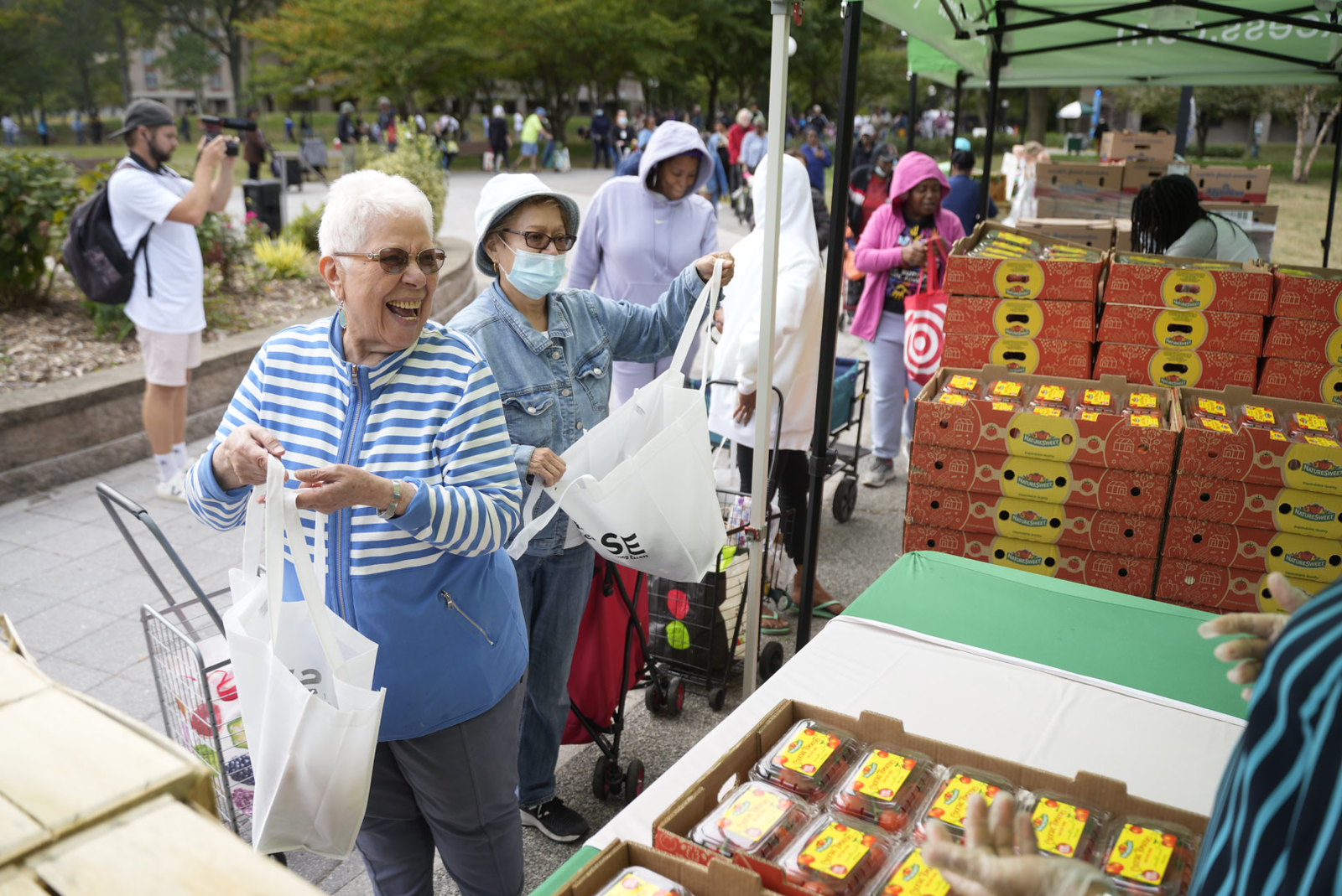 Community members receiving fresh produce at a Sharing Excess distribution